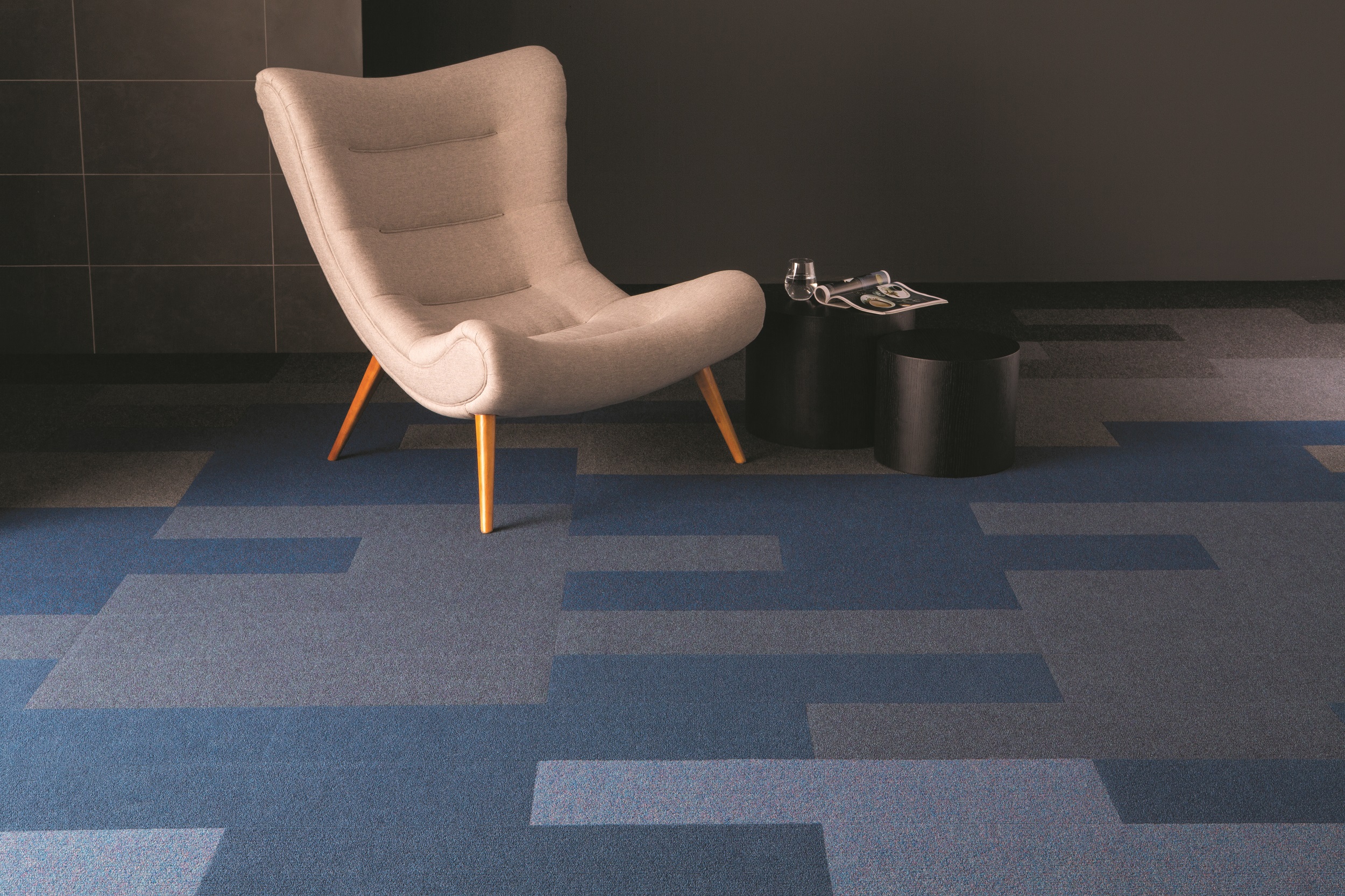 Heckmondwike Broadrib Onyx and Indigo Carpet Tile with chair and table.
