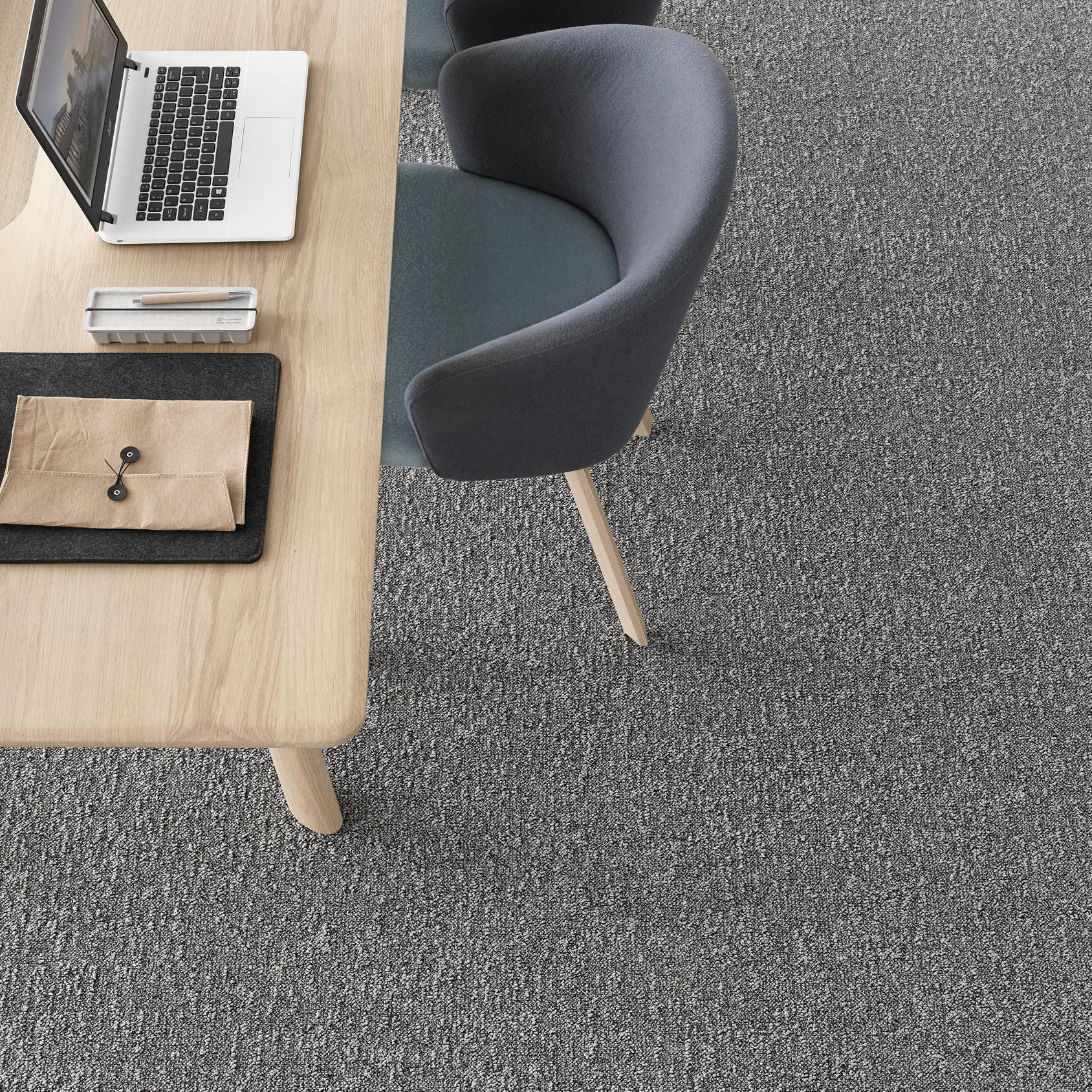 Desso Airmaster Earth Carpet Tiles used in office setting with table and chair