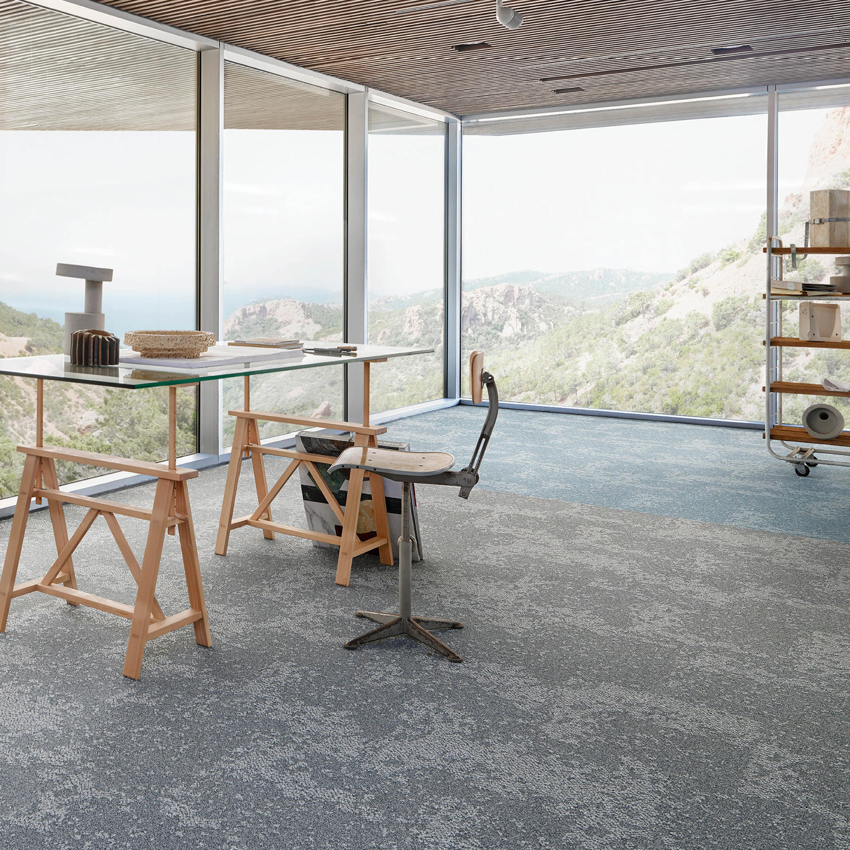 Desso Arable Carpet Tile in modern commercial space overlooking mountains
