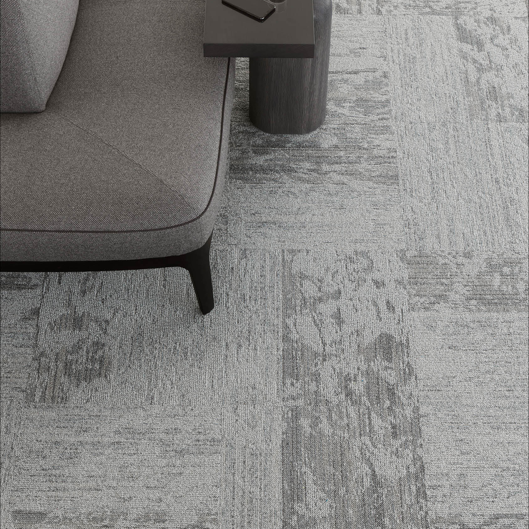 Desso Breccia Carpet Tile in a commercial office space in dark grey